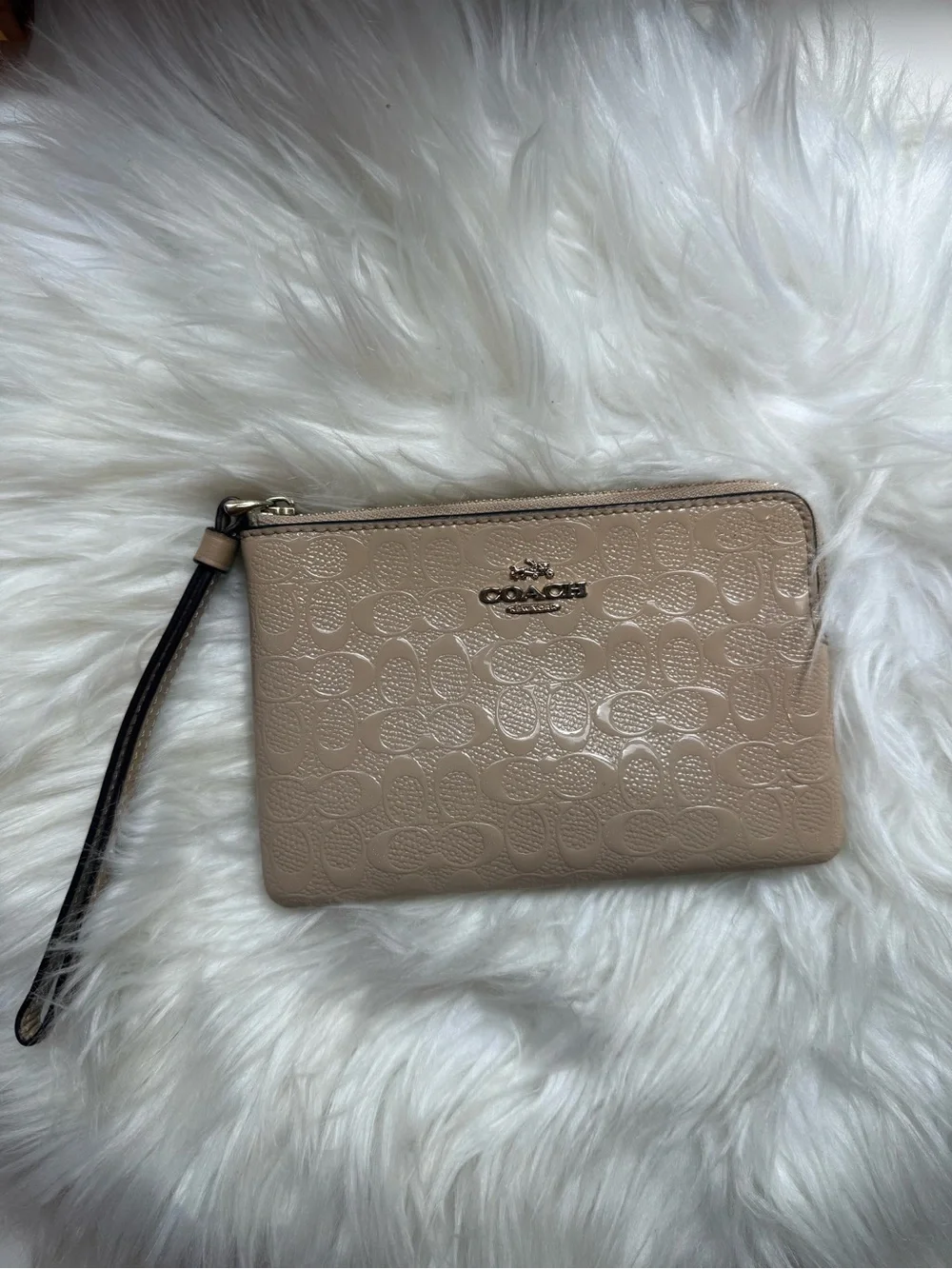 COACH Embossed Signature Wristlet in Neutral Beige